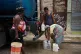 People fill jugs with water in Havana, Cuba, June 12, 2026