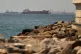 Tankers and cargo vessels are seen in the Gulf of Oman, along shipping routes linking the Strait of Hormuz and the Arabian Sea, Tuesday, June 16, 2026