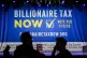 A large banner is seen at a campaign event for a proposed ‘billionaires tax’ in Los Angeles on February 18, 2026