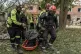 Rescuers carry a body that they removed from under the rubble of an apartment building following Russia's missile attack in Kharkiv, Ukraine, June 20, 2026