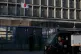 A delivery man drives past the Japanese Embassy in Beijing on November 24, 2025