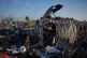 Palestinians inspect damage to their tents caused by an Israeli air strike in Khan Younis, Gaza Strip, June 30, 2026