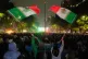 Mexican fans wave flags as they watch the World Cup round of 32 soccer match between Mexico and Ecuador near the Angel of Independence monument in Mexico City, June 30, 2026
