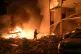Emergency services personnel work to extinguish a fire following Russian missile attacks in Kyiv, Ukraine, July 6, 2026
