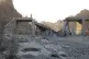 People stand on a bridge destroyed after a strike in Hormozgan province, southern Iran, July 18, 2026