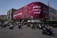 Motorcyclists ride past a billboard depicting US President Donald Trump with hands around his neck alongside the message ‘Revenge is inevitable’ in English and Farsi, in Tehran, Iran, July 27, 2026