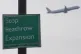 A plane flies past a 