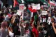 People take part in a National March for Palestine organised by Palestine Coalition, in central London