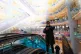 BACK IN BUSINESS: Shoppers ride on an escalator at a reopene