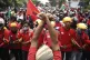 A labour demonstrator raises his fists in support of the pro