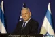 Israeli Prime Minister Benjamin Netanyahu listens during a n