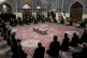 People pray over the flag-draped coffin of Mohsen Fakhrizade
