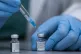 A health care professional prepares a Pfizer-BioNTech COVID-