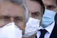 Brazilian President Jair Bolsonaro, centre, arrives for a pr