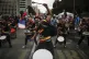 Young men perform in a drumline during an anti-government pr