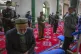 Uighurs and other members of the faithful pray during servic