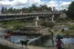 People bathe in the Massacre River on the border between Dom