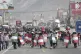 Demonstrators march with makeshift shields during a protest 