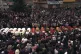 Residents surround coffins during a vigil for the more than 