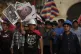Bearing signs with the photos of the victims of the ongoing 