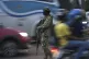 A soldier monitors vehicle traffic on the National Unity Bri