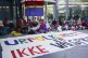 Activists wearing traditional Sami outfits sit in protest ou