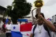 Demonstrators march in a parade during a protest against a m
