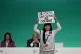 A demonstrator protests against the use of fossil fuels duri