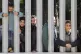 Members of a group of some 30 migrants seeking asylum are se