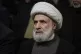 Hezbollah's deputy leader, Sheikh Naim Kassem, listens to a 