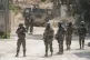 Israeli soldiers take position during an ongoing military op