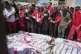 Mourners gather around the bodies of 8 Red Crescent emergenc