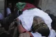 Palestinian mourners carry the body of 29-year-old Fares al-