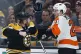 Boston Bruins' Steven Kampfer gets ready to punch the picket