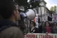 State hospital workers chant as they hold placards which rea