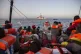 Migrants rest on a Mediterranea Saving Humans NGO boat on Ju