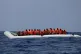 A rubber dinghy with over 80 migrants off the Libyan coast h