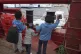 Children wave at a boat from aboard the Ocean Viking as it r