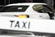 An Uber vehicle stops across the road from a taxi rank in Sy