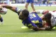 Warrington Wolves' Ryan Atkins stretches the ball towards th