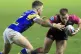 Hull KR's Chris Atkin (right) is tackled by Leeds Rhinos' Ri