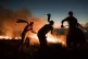 Firefighters tackling a wildfire on Winter Hill near Bolton,