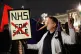 NHS nurses and doctors protest outside Buckimngham Palace, L