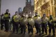 Police in riot gear during an anti-vaccination demonstration