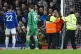 A protester ties himself to the goal frame during the Premie
