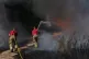 Firefighters battling a grass fire on Leyton flats in east L