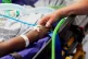 Senior Staff Nurse Jayne Farrance (right) holds the hand of 