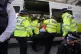Officers from the Metropolitan Police remove a Just Stop Oil