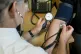 A doctor checking a patient's blood pressure