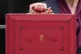 Chancellor of the Exchequer Rachel Reeves holds up her minis